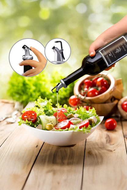 Damlatmaz başlıklı cam şişeden salataya zeytinyağı dökülmesi